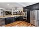 Open kitchen featuring granite countertops, stainless steel appliances and dark wood cabinetry at 5625 Twilight Way, Parker, CO 80134