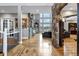 Spacious living room with hardwood floors, stone archway, and an abundance of natural light at 5625 Twilight Way, Parker, CO 80134