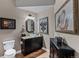 This charming powder room features a vanity with granite countertops and stylish decor at 5625 Twilight Way, Parker, CO 80134