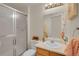 Simple bathroom with a single sink, shower, and a small cabinet at 2946 S Espana Ct, Aurora, CO 80013