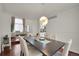 Bright dining room with hardwood floors and kitchen view at 2946 S Espana Ct, Aurora, CO 80013