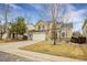 Two-story house with attached garage and front yard at 2946 S Espana Ct, Aurora, CO 80013