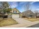 Two-story house with attached garage and landscaping at 2946 S Espana Ct, Aurora, CO 80013