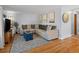 Inviting living room with hardwood floors, neutral sectional, and a view of the entrance at 640 Marble St, Broomfield, CO 80020