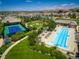 Beautiful community aerial featuring a pool, tennis court, manicured lawns, and walking paths at 12114 Alcott St, Westminster, CO 80234