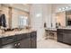 Bright bathroom with granite counters, dual sinks, and a separate vanity area at 12114 Alcott St, Westminster, CO 80234