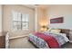 Cozy bedroom with a large window and neutral color palette at 12114 Alcott St, Westminster, CO 80234