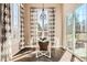 Bright dining area featuring a glass table, stylish seating, and natural light at 12114 Alcott St, Westminster, CO 80234