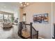 Spacious foyer with hardwood floors, staircase, and views into the living area at 12114 Alcott St, Westminster, CO 80234
