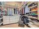 Spacious walk-in closet featuring custom shelving and ample storage space at 12114 Alcott St, Westminster, CO 80234