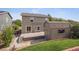 This backyard has a patio area with steps and a storage shed off the back of the property at 9697 Marmot Ridge Cir, Littleton, CO 80125