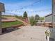 This backyard has a multi-tiered brick patio area with lovely terraced garden beds at 9697 Marmot Ridge Cir, Littleton, CO 80125