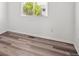 Bedroom with modern floors, a window and neutral paint at 9697 Marmot Ridge Cir, Littleton, CO 80125