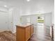 Bright open-concept living area with wood floors and sliding glass doors to the backyard at 9697 Marmot Ridge Cir, Littleton, CO 80125
