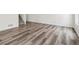 Modern living area with sleek flooring and neutral tones, offering a versatile canvas for personalization at 9697 Marmot Ridge Cir, Littleton, CO 80125