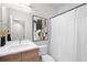 Clean bathroom with stylish vanity, modern fixtures, and a shower with curtain at 3520 W Connejos Pl # 5, Denver, CO 80204