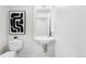 Sleek bathroom featuring modern fixtures, a floating sink, and minimalist design at 3520 W Connejos Pl # 5, Denver, CO 80204