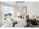 Bright bedroom with city views, stylish décor, and comfortable furnishings at 3520 W Connejos Pl # 5, Denver, CO 80204