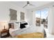 Relaxing bedroom featuring a ceiling fan, balcony access, and neutral color scheme at 3520 W Connejos Pl # 5, Denver, CO 80204