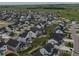Wide aerial shot displaying a large neighborhood with uniform housing and community planning at 1143 Williams Loop, Elizabeth, CO 80107
