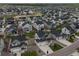 Aerial shot showcases a residential neighborhood with modern homes, neat landscaping and ample street parking at 1143 Williams Loop, Elizabeth, CO 80107