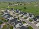 Overview of a residential area featuring numerous houses, street layout, and surrounding green fields at 1143 Williams Loop, Elizabeth, CO 80107