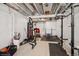 Basement transformed into a home gym, fully equipped with weightlifting and punching bag at 1143 Williams Loop, Elizabeth, CO 80107