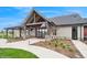 Community building featuring a peaked roof, gray and red siding and large glass entrance at 1143 Williams Loop, Elizabeth, CO 80107