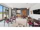 Bright dining area with modern decor, stylish tables, and large windows showcasing outdoor views at 1143 Williams Loop, Elizabeth, CO 80107