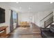 Bright dining area with hardwood floors, modern lighting, and comfortable seating arrangement at 1143 Williams Loop, Elizabeth, CO 80107
