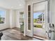 Bright entryway featuring hardwood floors, large windows, and a view of the home's exterior at 1143 Williams Loop, Elizabeth, CO 80107
