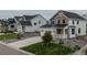 Charming two-story home featuring stone accents, a covered porch, and a well-manicured front yard at 1143 Williams Loop, Elizabeth, CO 80107