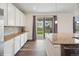 Well-lit kitchen featuring a granite countertop, stainless steel appliances and sliding door access at 1143 Williams Loop, Elizabeth, CO 80107