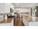 Modern kitchen features stainless steel appliances, granite countertops, and white cabinetry at 1143 Williams Loop, Elizabeth, CO 80107