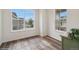 Bright living room featuring hardwood floors, large windows, and a view of the neighborhood at 1143 Williams Loop, Elizabeth, CO 80107