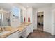 Bathroom with double vanity sinks, stone countertops, and glass-enclosed shower at 1143 Williams Loop, Elizabeth, CO 80107