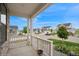 Charming porch view showcasing neighborhood houses, a well-maintained lawn, and pleasant surroundings at 1143 Williams Loop, Elizabeth, CO 80107