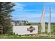 Community entrance featuring 'Independence' signage and decorative flags against a backdrop of modern homes at 1143 Williams Loop, Elizabeth, CO 80107