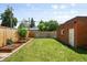Backyard with green lawn, garden beds and storage shed at 534 S Pearl St, Denver, CO 80209