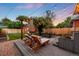 Beautifully landscaped backyard with lounge chairs, dining table, and string lights at 534 S Pearl St, Denver, CO 80209