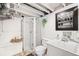 Basement bathroom with walk-in shower, white vanity and modern fixtures, providing functionality at 534 S Pearl St, Denver, CO 80209