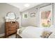 Bright bedroom boasts a comfortable bed, dresser, and ample natural light at 534 S Pearl St, Denver, CO 80209