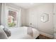 Cozy bedroom featuring a comfortable bed and bright window with a view at 534 S Pearl St, Denver, CO 80209