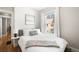 Inviting bedroom with a soft bed, natural light, and serene decor at 534 S Pearl St, Denver, CO 80209