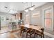 Bright dining area with hardwood floors, open to a modern kitchen, perfect for Gathering meals at 534 S Pearl St, Denver, CO 80209