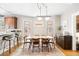 Bright dining room features a large table and chairs with modern chandelier lighting at 534 S Pearl St, Denver, CO 80209