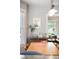 Bright dining room features a wood table, cabinet, picture frame and view to living room at 534 S Pearl St, Denver, CO 80209