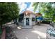 Charming cafe with outdoor seating area, blue awnings, and lush greenery at 534 S Pearl St, Denver, CO 80209