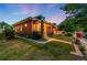 Side view of a well-manicured front yard with charming brickwork and a 'For Sale' sign at 534 S Pearl St, Denver, CO 80209