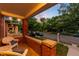 Inviting front porch features classic brick details and comfortable wicker seating with a street view at 534 S Pearl St, Denver, CO 80209